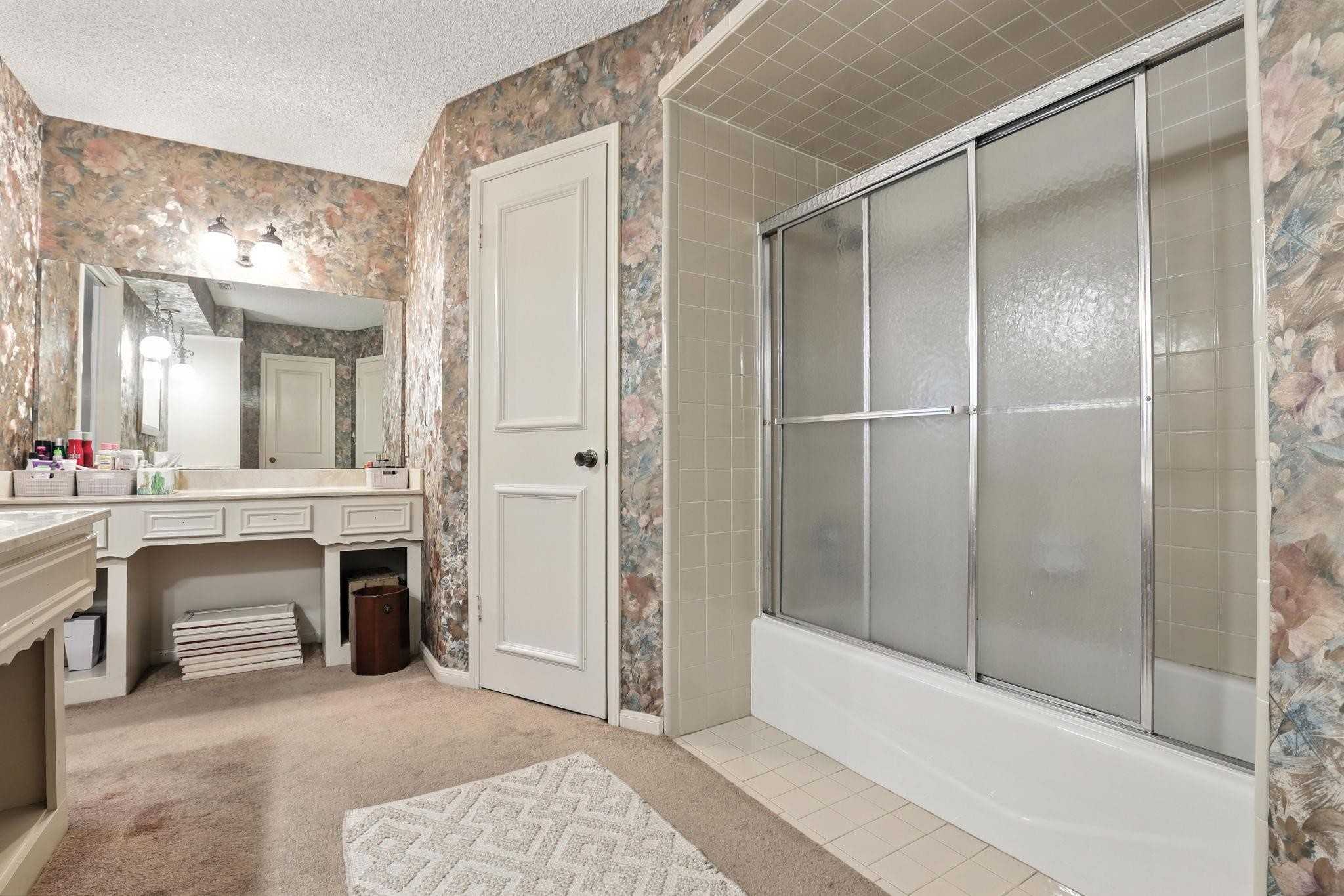 2910 Riata Lane Houston, TX 77080 - Photo 17 of 23 a spacious bathroom with a shower and a sink