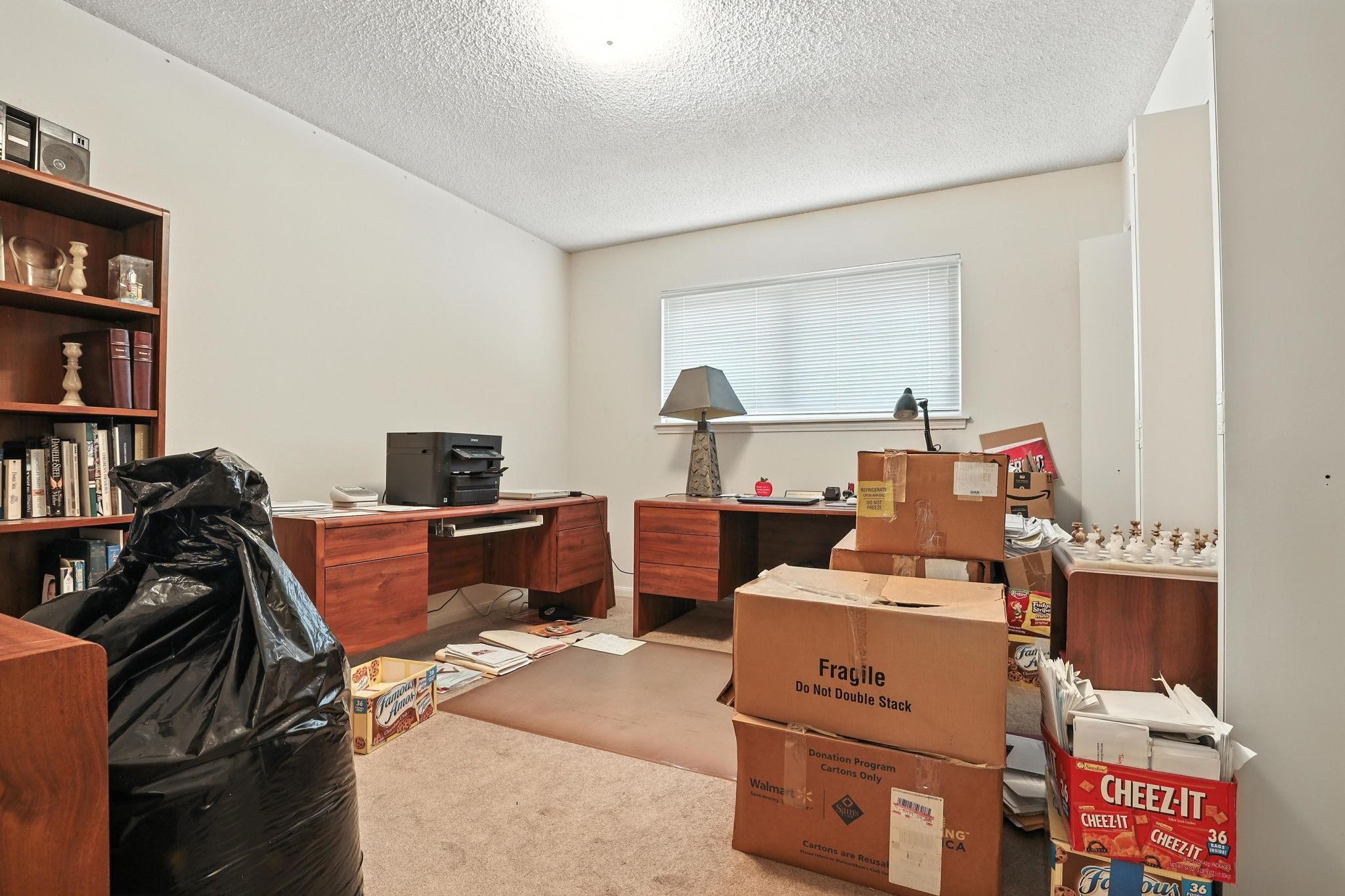 2910 Riata Lane Houston, TX 77080 - Photo 18 of 23 a view of a workspace with furniture