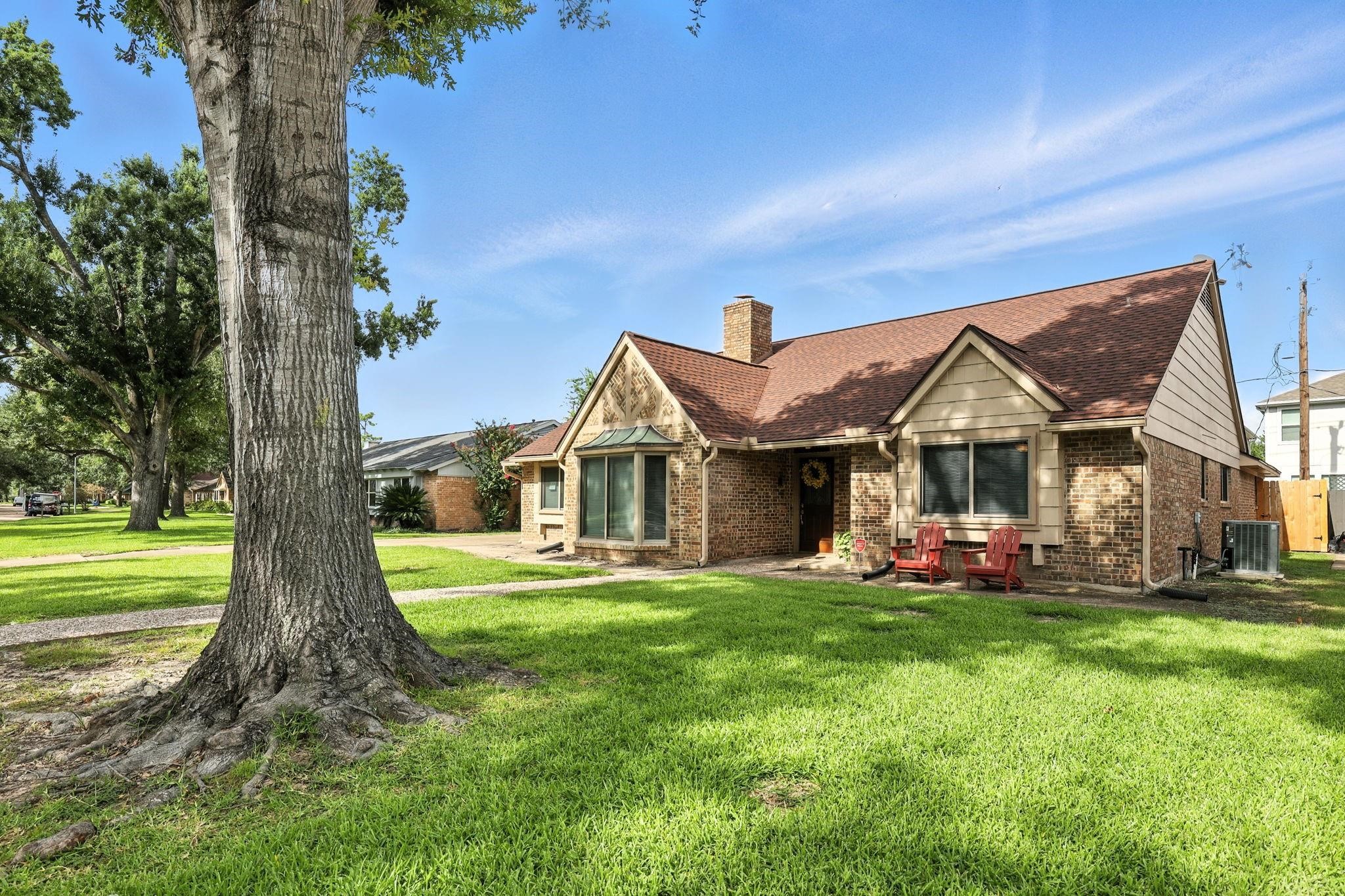 2910 Riata Lane Houston, TX 77080 - Photo 2 of 23 a front view of a house with a yard