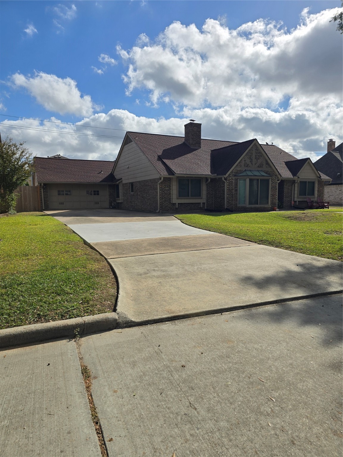 2910 Riata Lane Houston, TX 77080 - Photo 4 of 23 a front view of a house with a yard and garage