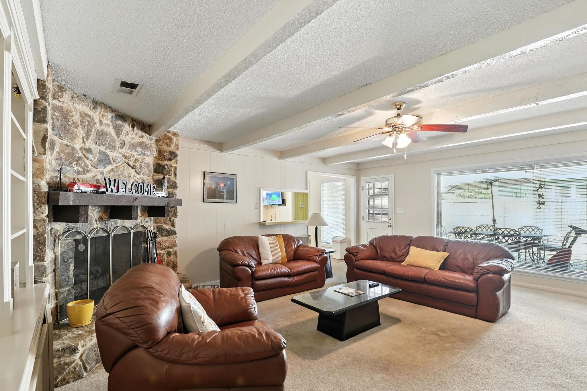 2910 Riata Lane Houston, TX 77080 - Photo 6 of 23 a living room with furniture and a chandelier
