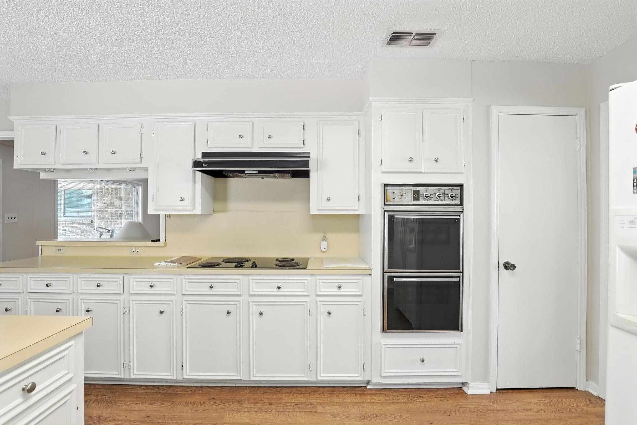 2910 Riata Lane Houston, TX 77080 - Photo 9 of 23 a kitchen with stainless steel appliances granite countertop a refrigerator and a stove top oven
