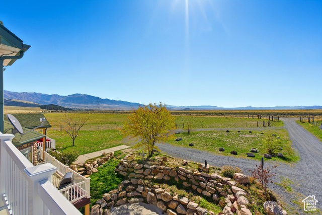 4768 East Hickman Canyon Road Stockton, UT 84071 - Photo 32 of 85 Mountain view from west side second floor bedroom balcony with rural landscape.