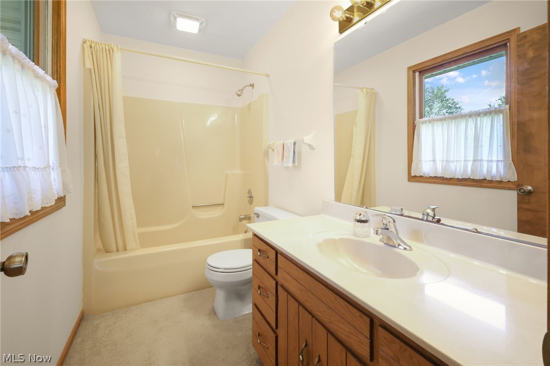 155 Oldman Road Wooster, OH 44691 - Photo 25 of 37 Full bathroom featuring shower / bath combo, toilet, and vanity