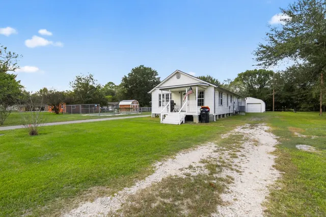 a view of a house with a big yard