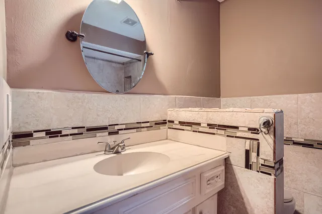 a bathroom with a sink and a mirror