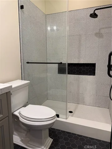 a bathroom with a bathtub and shower