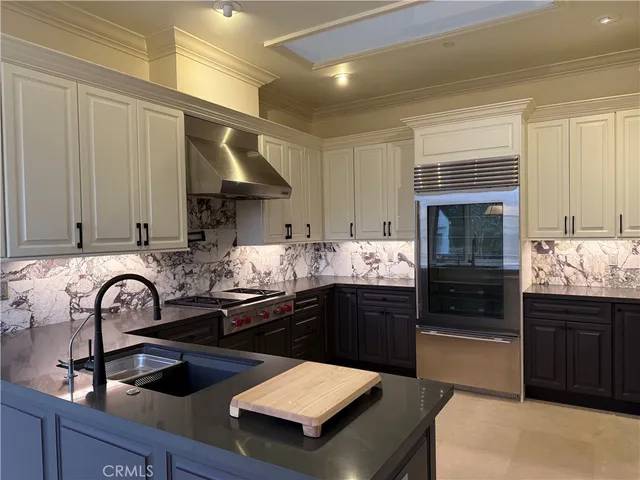 a kitchen with sink and stove