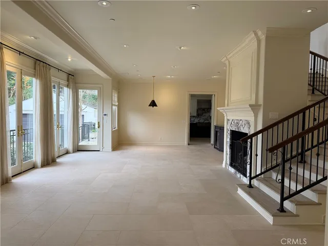 a view of an empty room with stairs