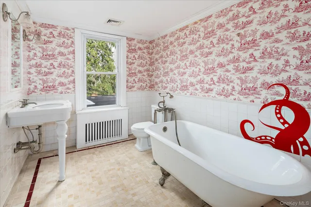 a bathroom with a bathtub and a sink