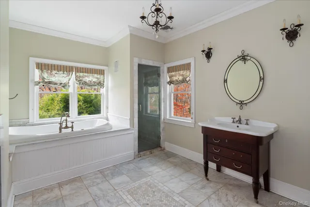 a bathroom with a bathtub and a sink
