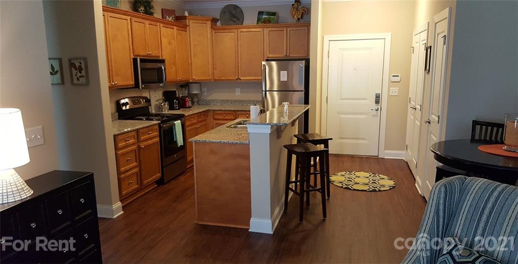 920 Stockbridge Drive Fort Mill, SC 29708 - Photo 11 of 20 a kitchen with a refrigerator stove and a window