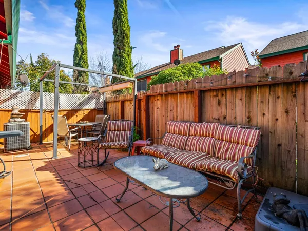 a view of a chairs and table in the patio