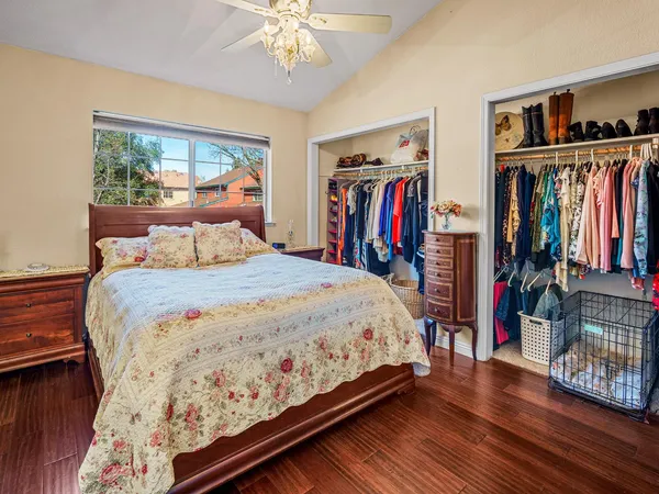 a bedroom with a large bed and a large window