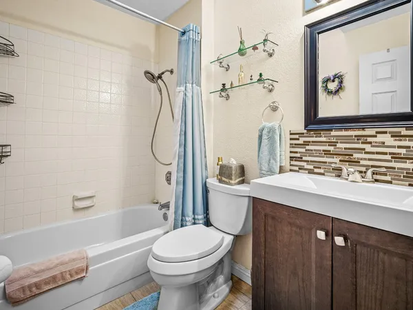 a bathroom with a sink a toilet and a bathtub