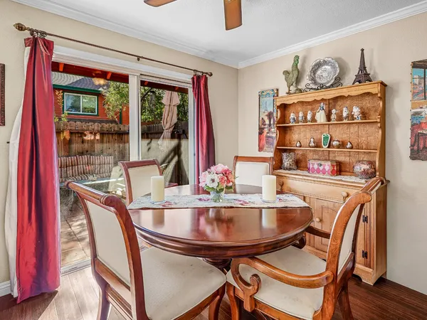 a dining room with furniture and window
