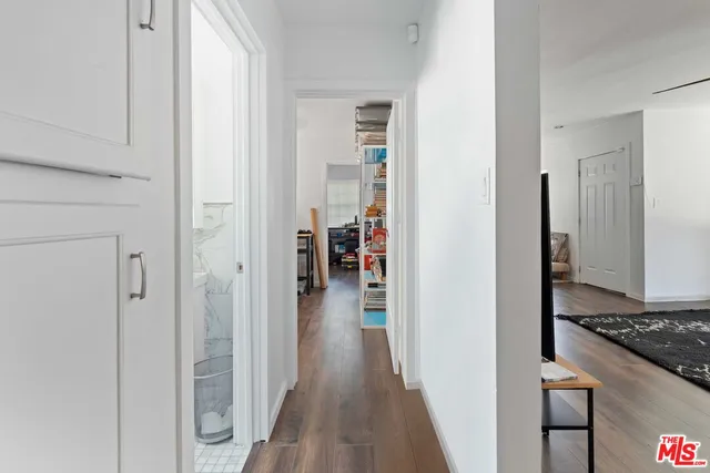 a bedroom with a bed and a walk in closet