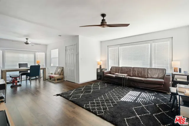 a living room with furniture and a rug