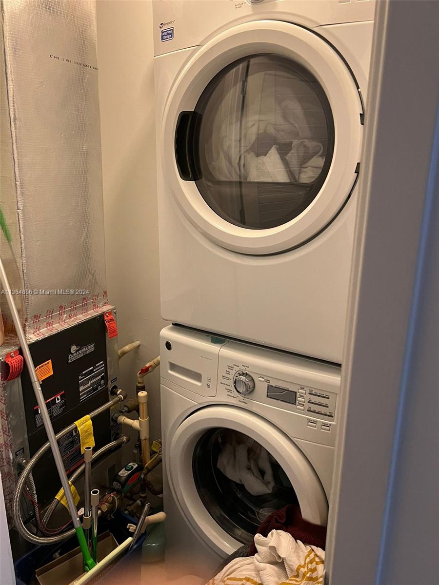 1010 Brickell Avenue, Unit 2010 Miami, FL 33131 - Photo 12 of 13 a utility room with dryer and washer