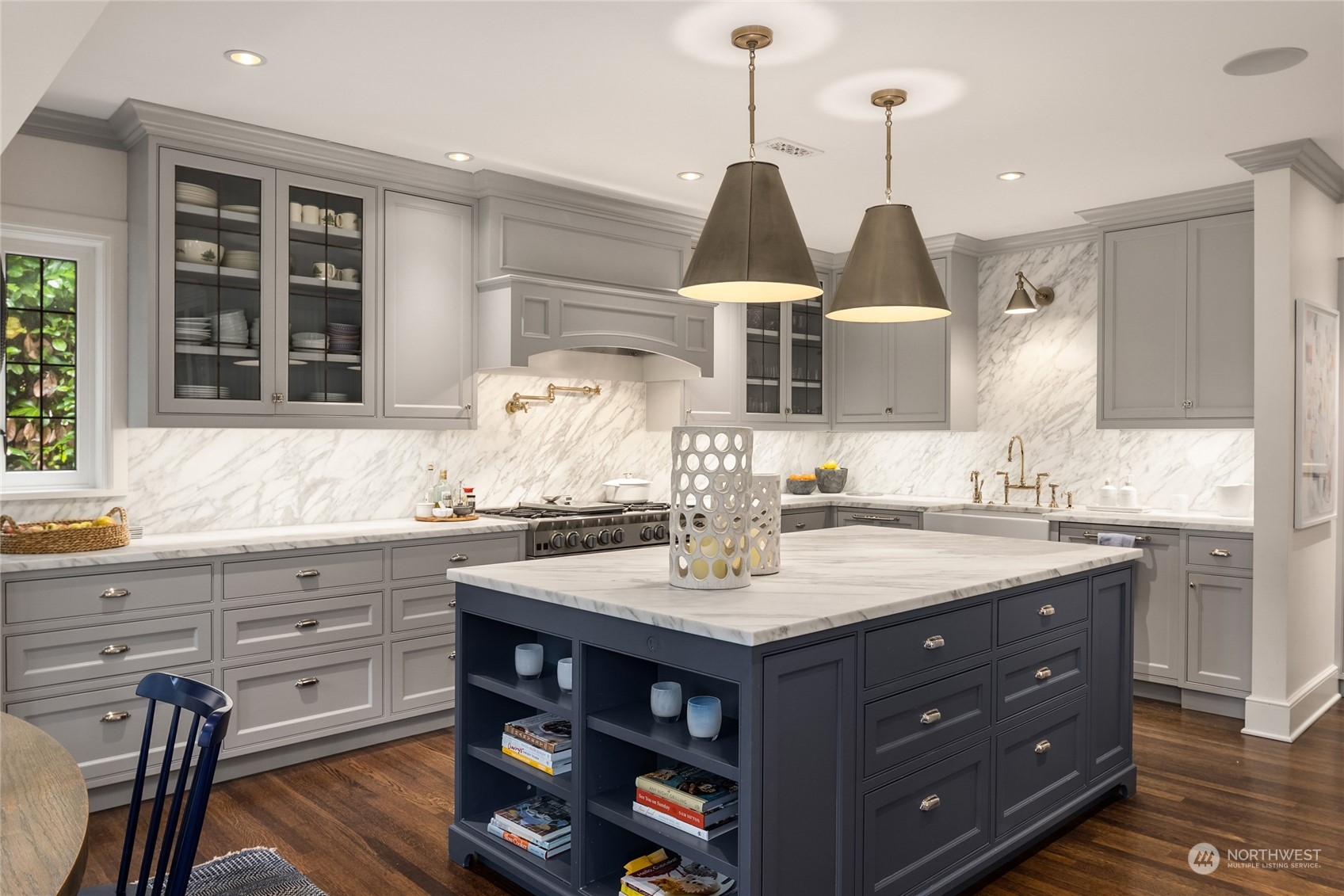 2045 Parkside Drive East Seattle, WA 98112 - Photo 16 of 38 a kitchen with a sink a center island and cabinets