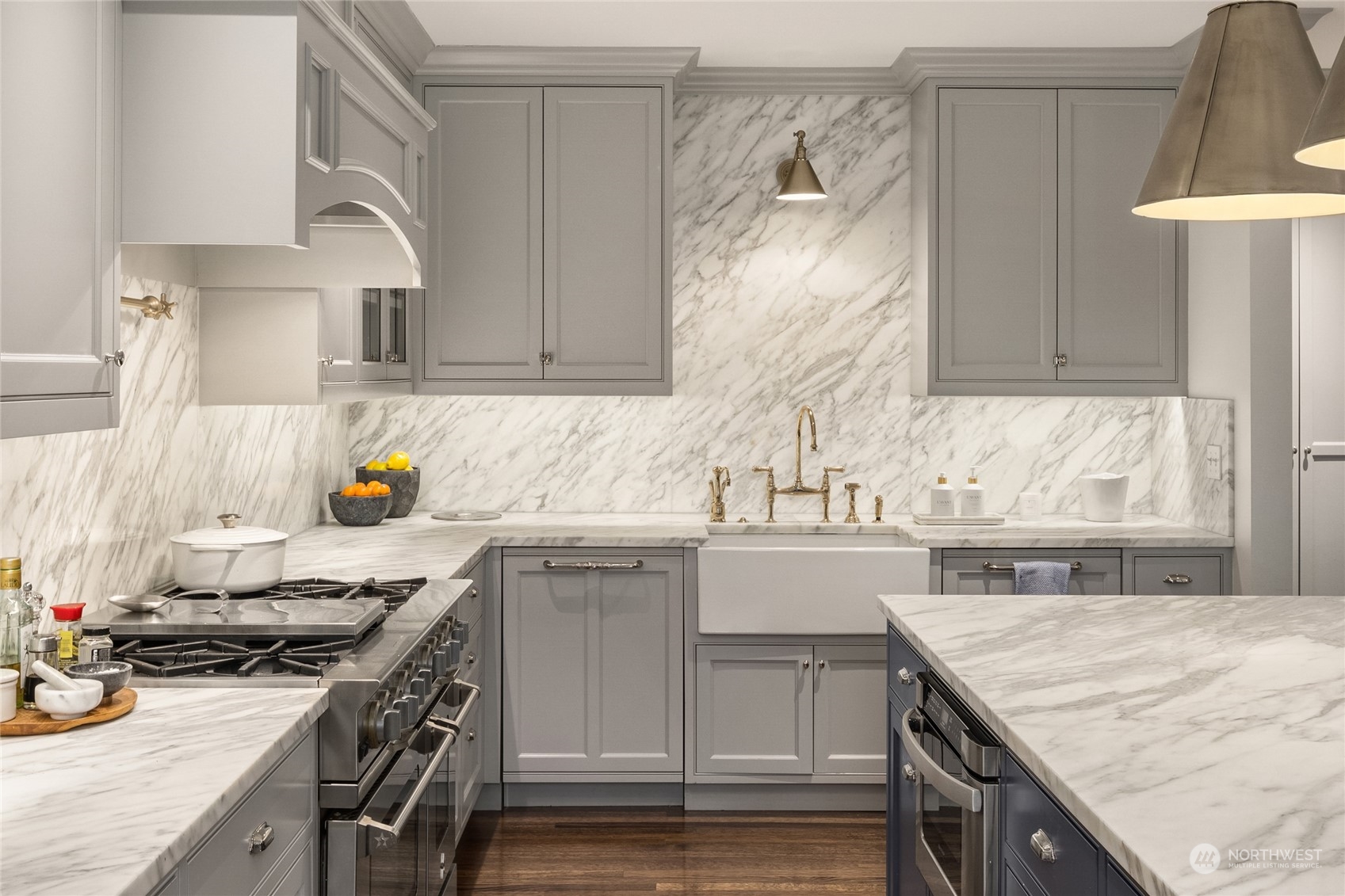 2045 Parkside Drive East Seattle, WA 98112 - Photo 17 of 38 a kitchen with a sink a stove and cabinets