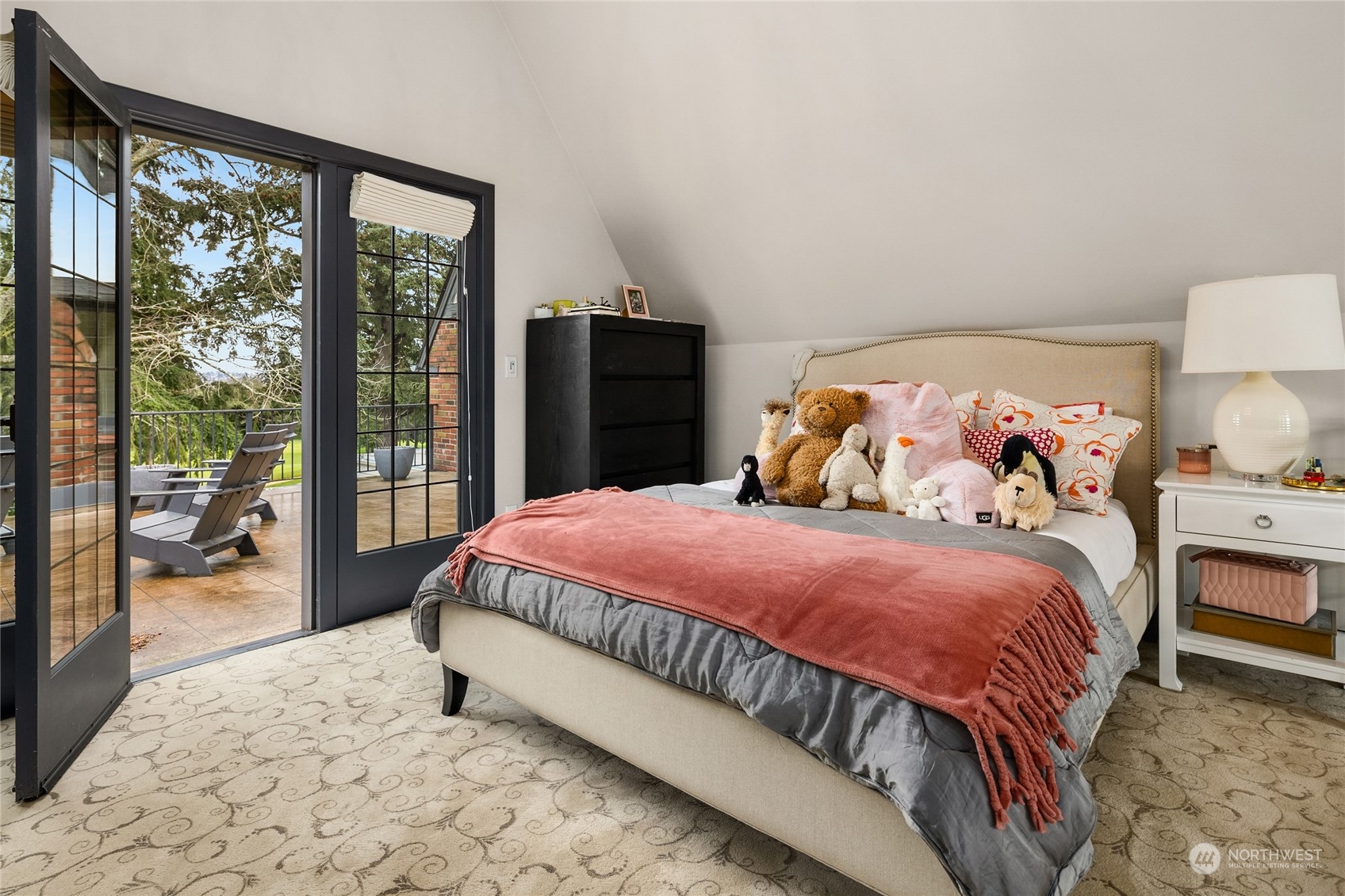 2045 Parkside Drive East Seattle, WA 98112 - Photo 22 of 38 a bedroom with a large bed and a large window