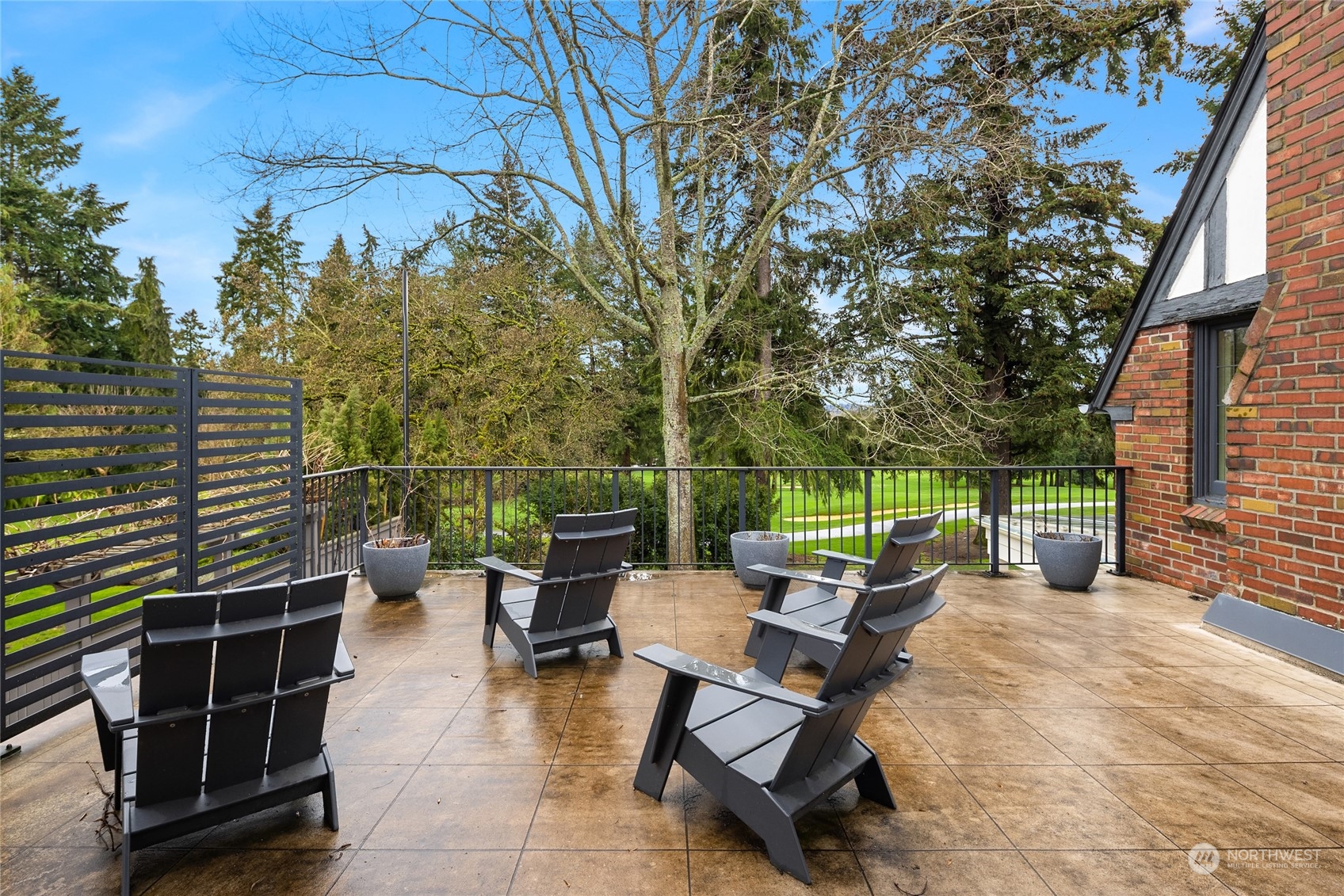 2045 Parkside Drive East Seattle, WA 98112 - Photo 23 of 38 a backyard of a house with table and chairs