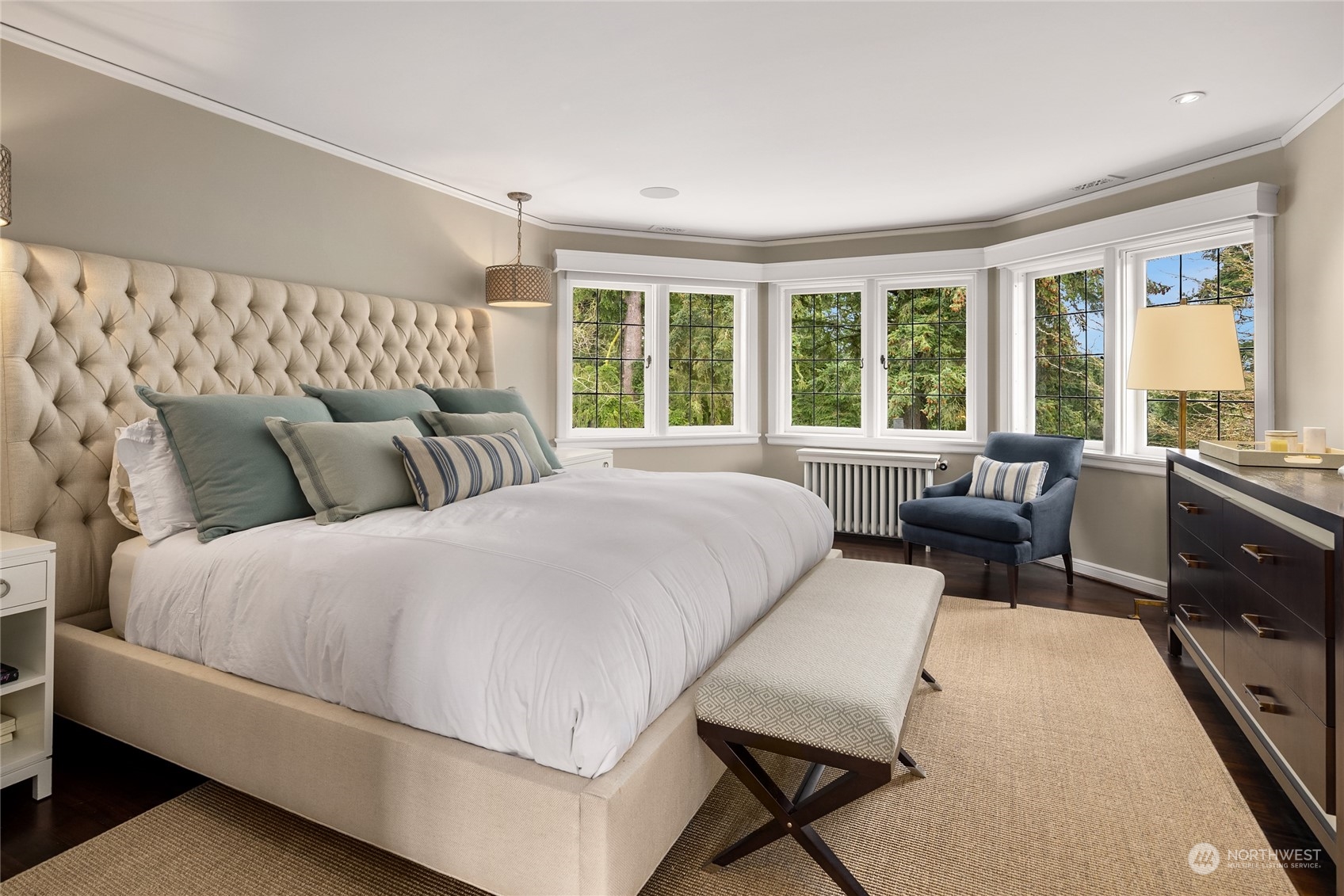 2045 Parkside Drive East Seattle, WA 98112 - Photo 25 of 38 a bedroom with a bed a couch and a dresser next to a window