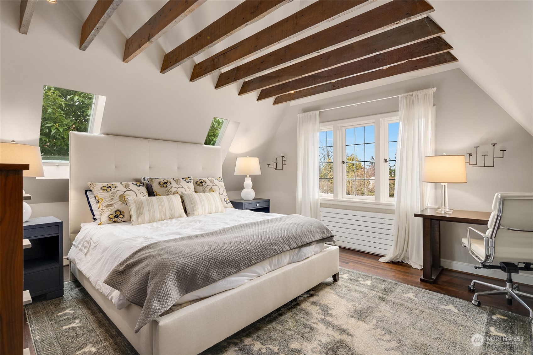 2045 Parkside Drive East Seattle, WA 98112 - Photo 27 of 38 a bedroom with a bed a chair and a large window