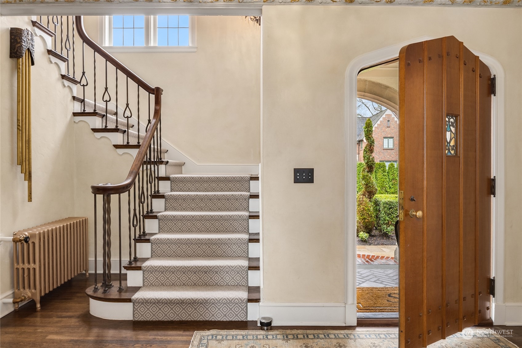 2045 Parkside Drive East Seattle, WA 98112 - Photo 3 of 38 a view of staircase with wooden floor and a potted plant