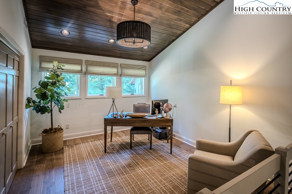 804 Crest Trail Linville, NC 28646 - Photo 22 of 40 a view of a livingroom with furniture and a potted plant