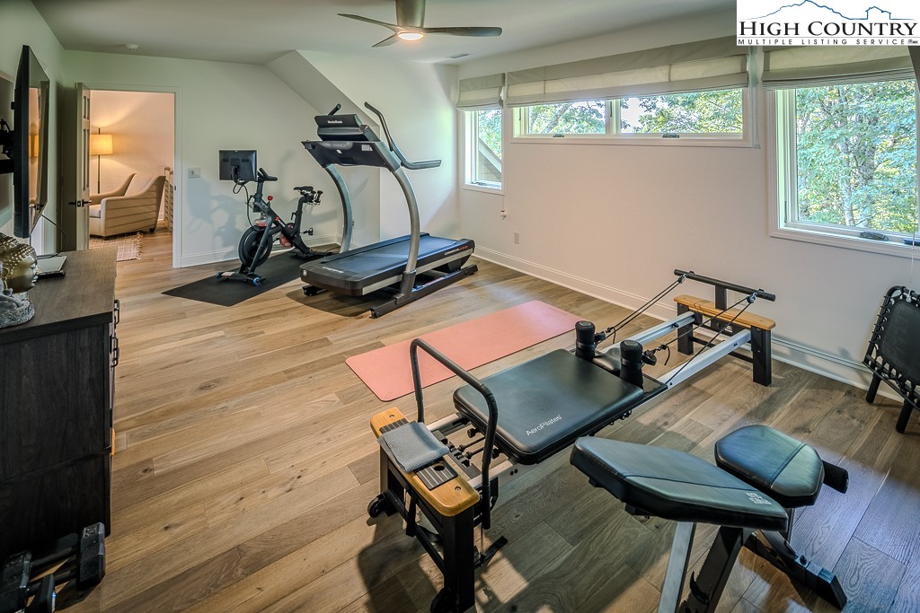 804 Crest Trail Linville, NC 28646 - Photo 23 of 40 a room with gym equipment and windows