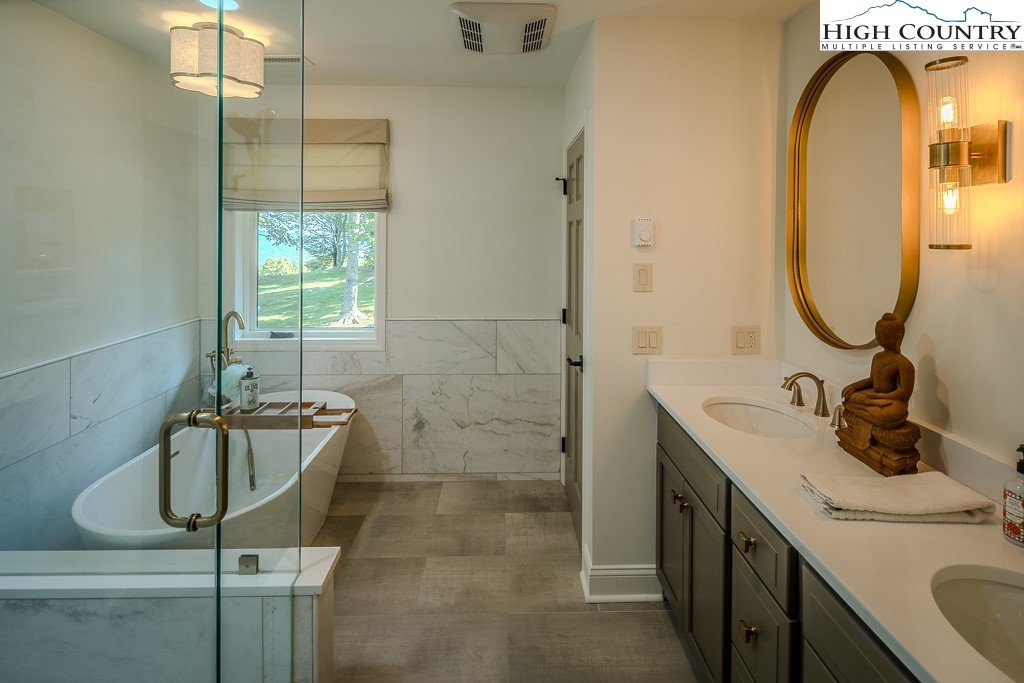804 Crest Trail Linville, NC 28646 - Photo 24 of 40 a bathroom with a sink and a mirror