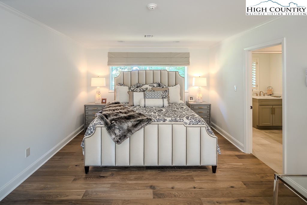 804 Crest Trail Linville, NC 28646 - Photo 27 of 40 a view of a hallway with wooden floor and staircase