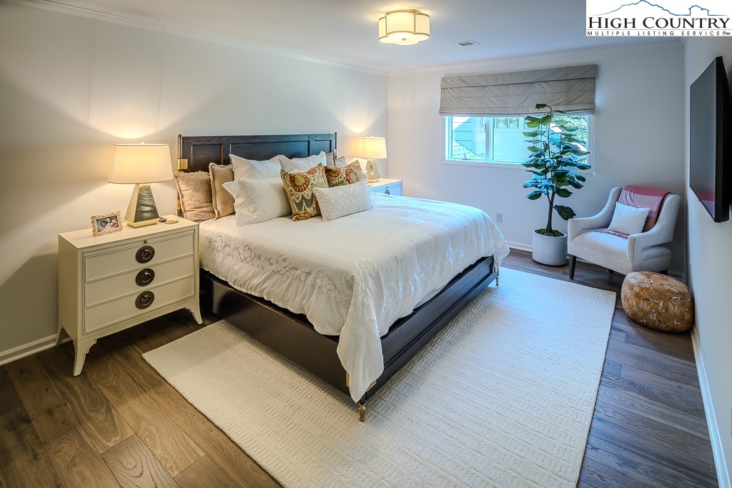 804 Crest Trail Linville, NC 28646 - Photo 29 of 40 a bedroom with bed and a couch