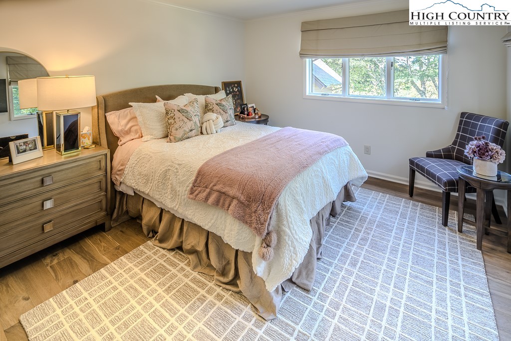 804 Crest Trail Linville, NC 28646 - Photo 31 of 40 a spacious bedroom with a bed and a window