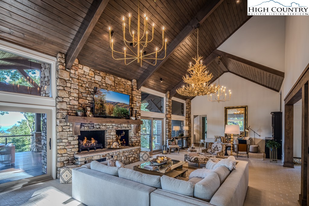804 Crest Trail Linville, NC 28646 - Photo 8 of 40 a living room with furniture and a fireplace