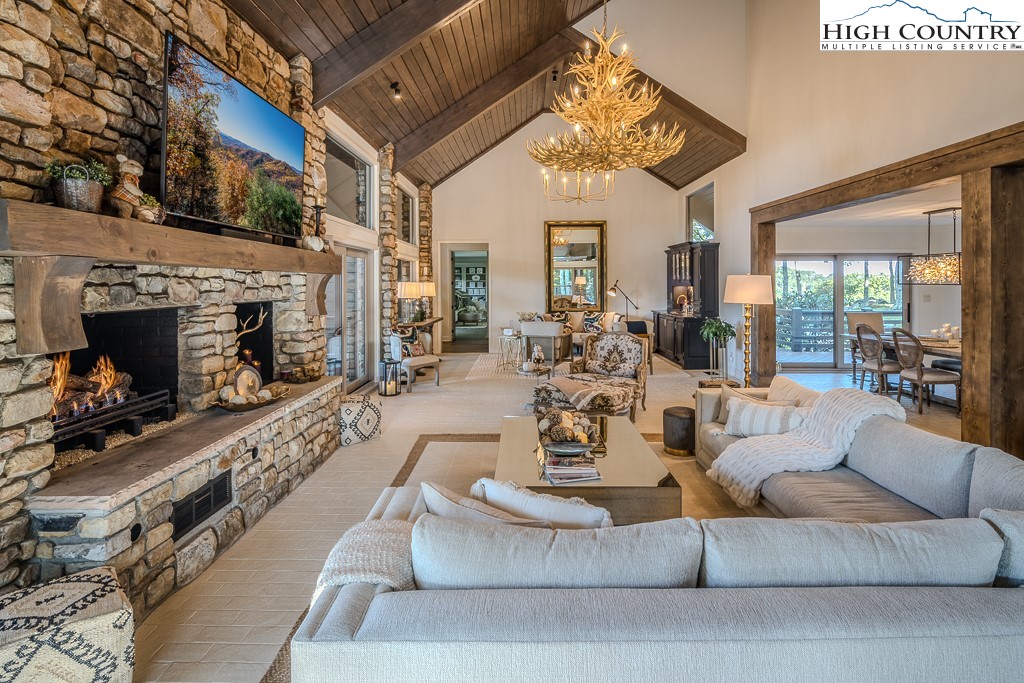 804 Crest Trail Linville, NC 28646 - Photo 9 of 40 a living room with furniture and a fireplace