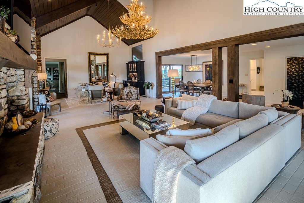 804 Crest Trail Linville, NC 28646 - Photo 10 of 40 a living room with furniture and a chandelier