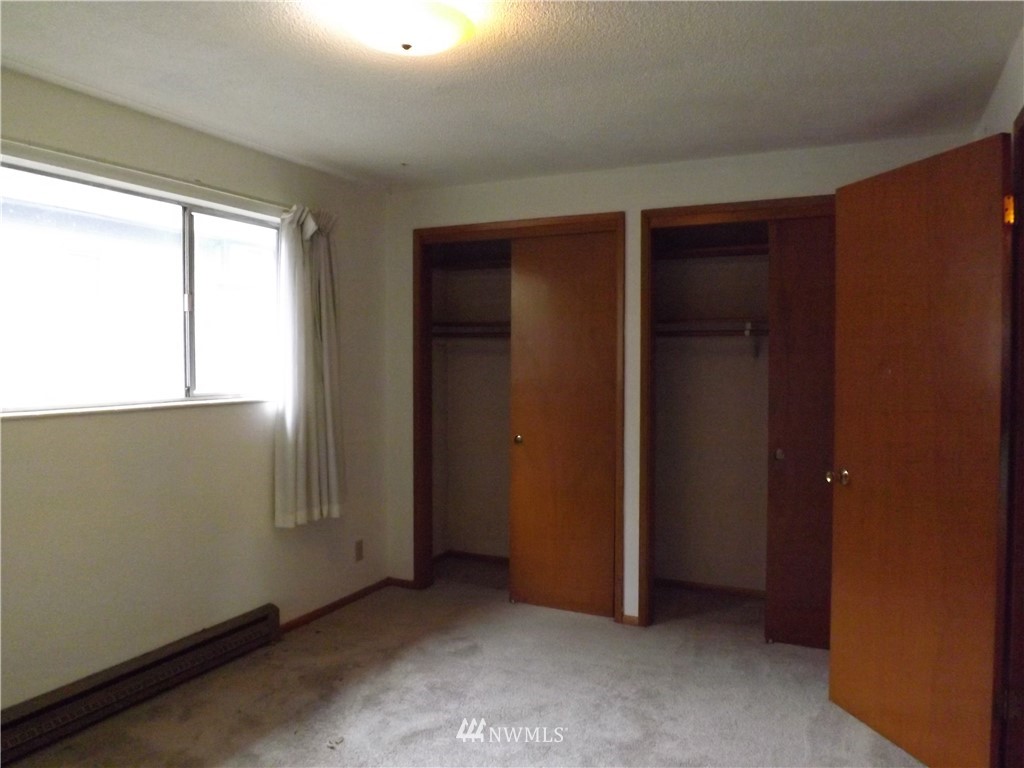 4215 Whitman Avenue North Seattle, WA 98103 - Photo 4 of 16 an empty room with windows