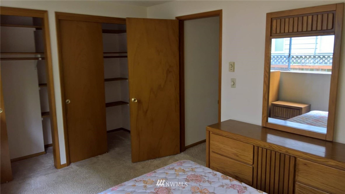 4215 Whitman Avenue North Seattle, WA 98103 - Photo 6 of 16 a room that has a bed in it