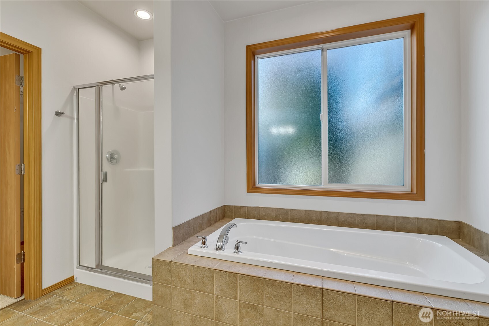 1720 Garfield Street, Unit 4 Enumclaw, WA 98022 - Photo 23 of 38 a bathroom with a tub a sink and a shower