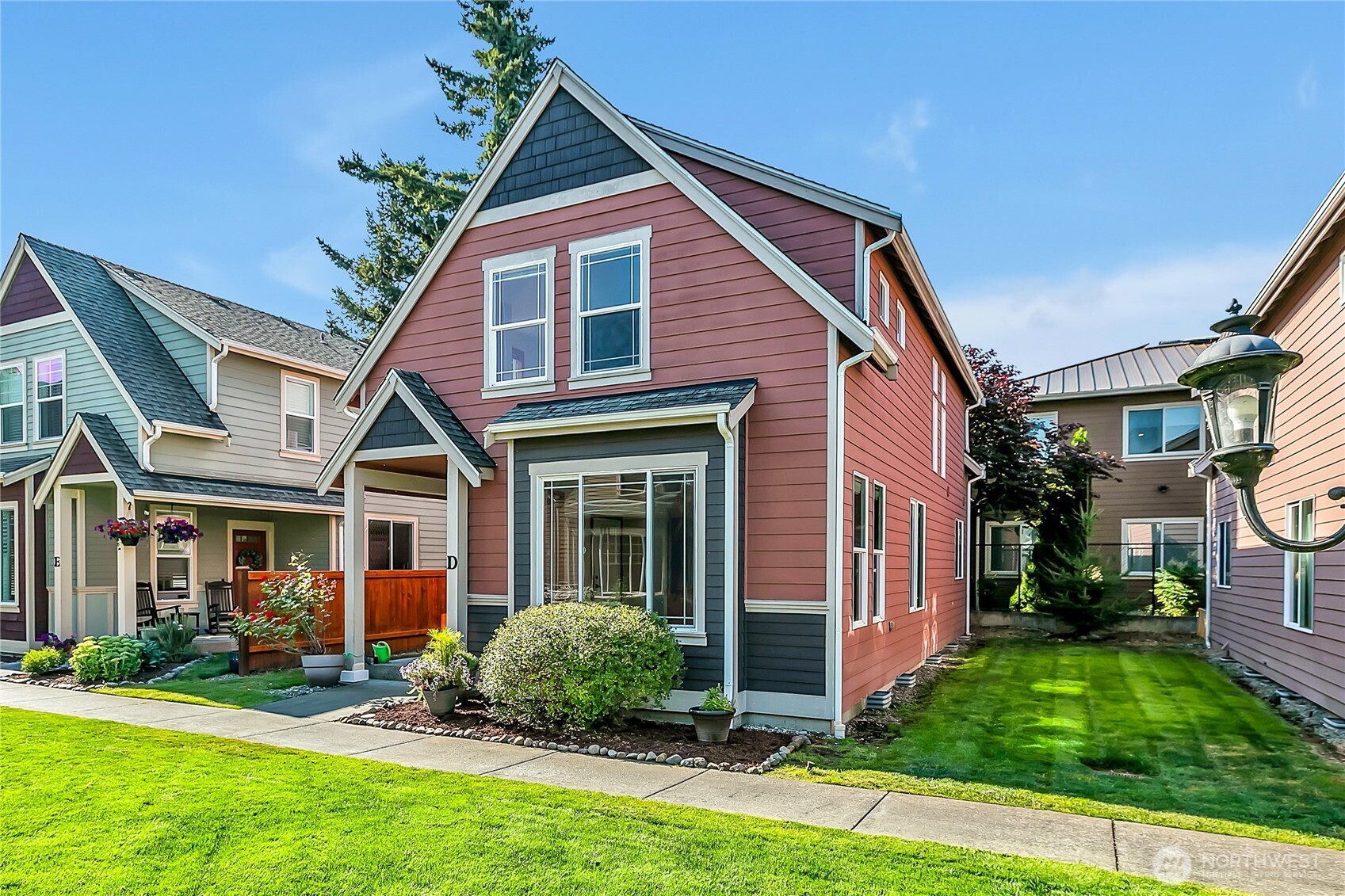 1720 Garfield Street, Unit 4 Enumclaw, WA 98022 - Photo 3 of 38 a front view of a house with a yard