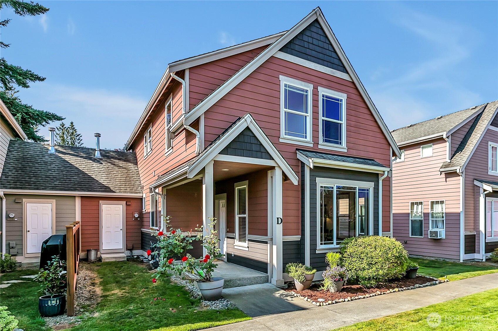 1720 Garfield Street, Unit 4 Enumclaw, WA 98022 - Photo 4 of 38 a front view of a house with garden