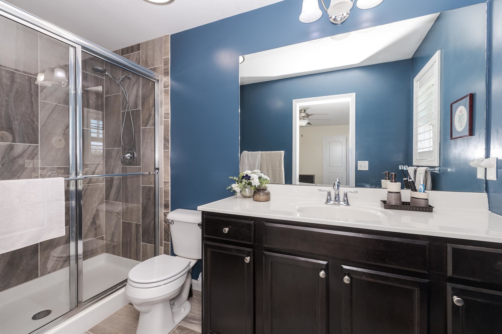 212 Springdale Avenue Bloomington, IL 61704 - Photo 17 of 37 a bathroom with a sink a toilet and shower