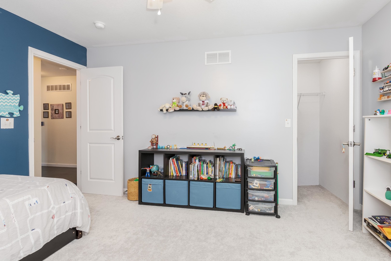212 Springdale Avenue Bloomington, IL 61704 - Photo 20 of 37 a bedroom with furniture and a book shelf