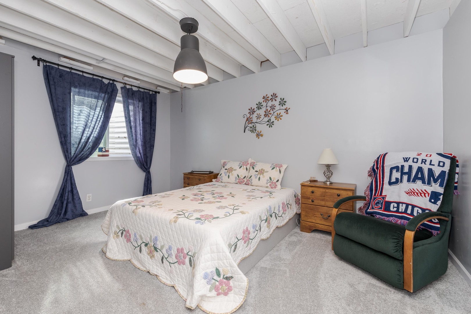 212 Springdale Avenue Bloomington, IL 61704 - Photo 27 of 37 a bedroom with a bed a chandelier and dresser