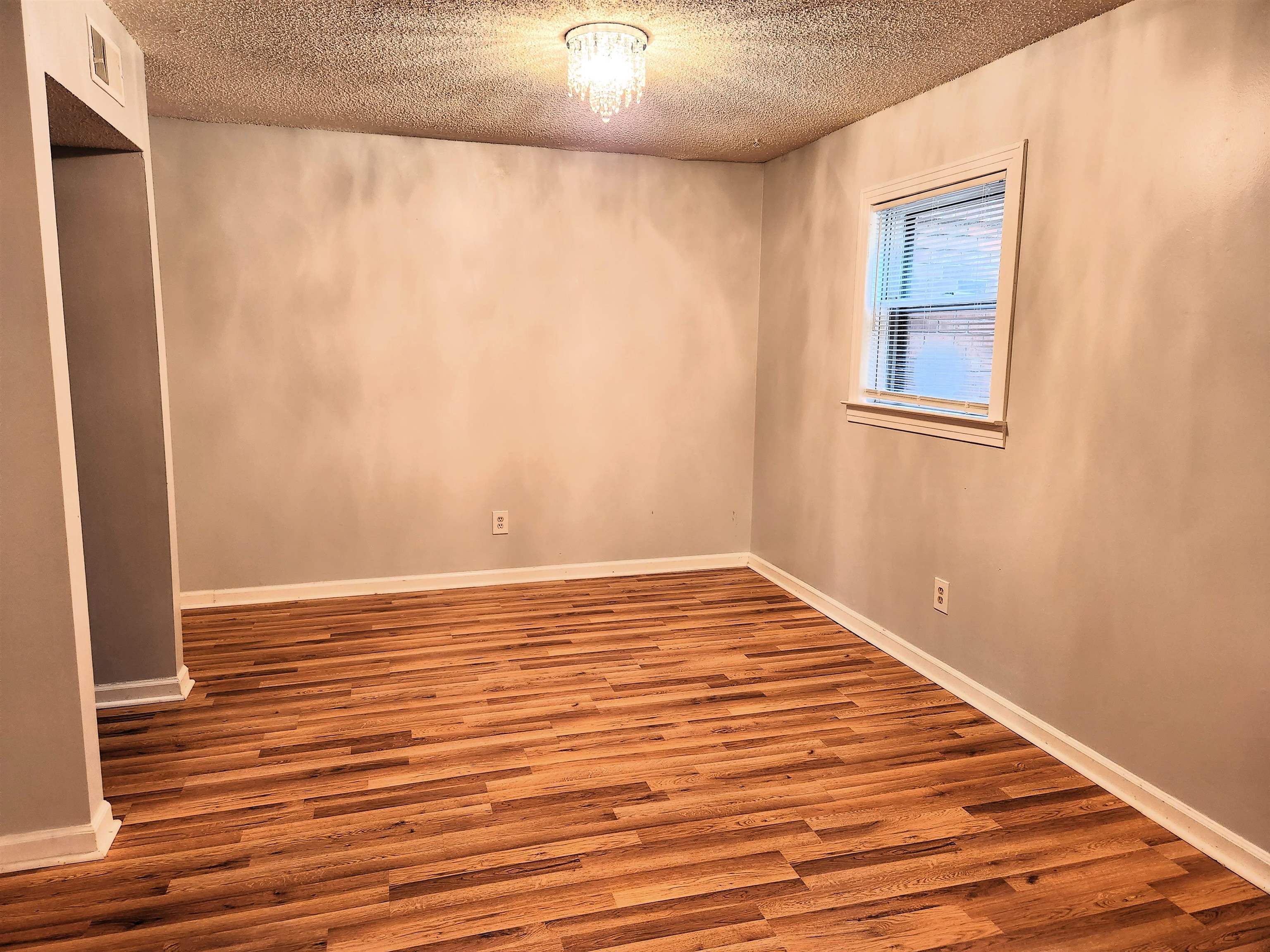7188 Pleasant Ridge Road Arlington, TN 38002 - Photo 12 of 28 a view of empty room with wooden floor and fan