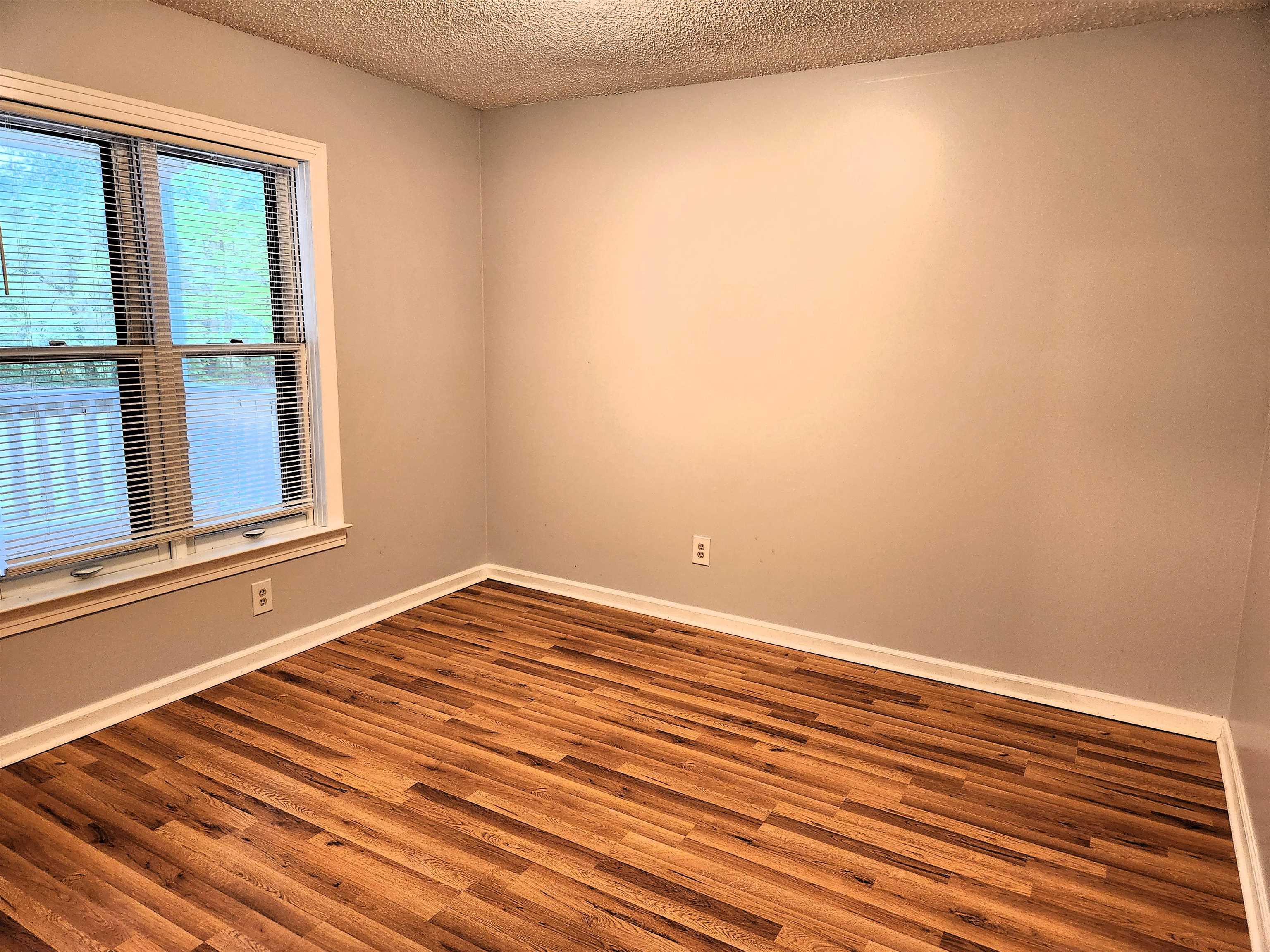 7188 Pleasant Ridge Road Arlington, TN 38002 - Photo 13 of 28 a view of a room with wooden floor and cabinet