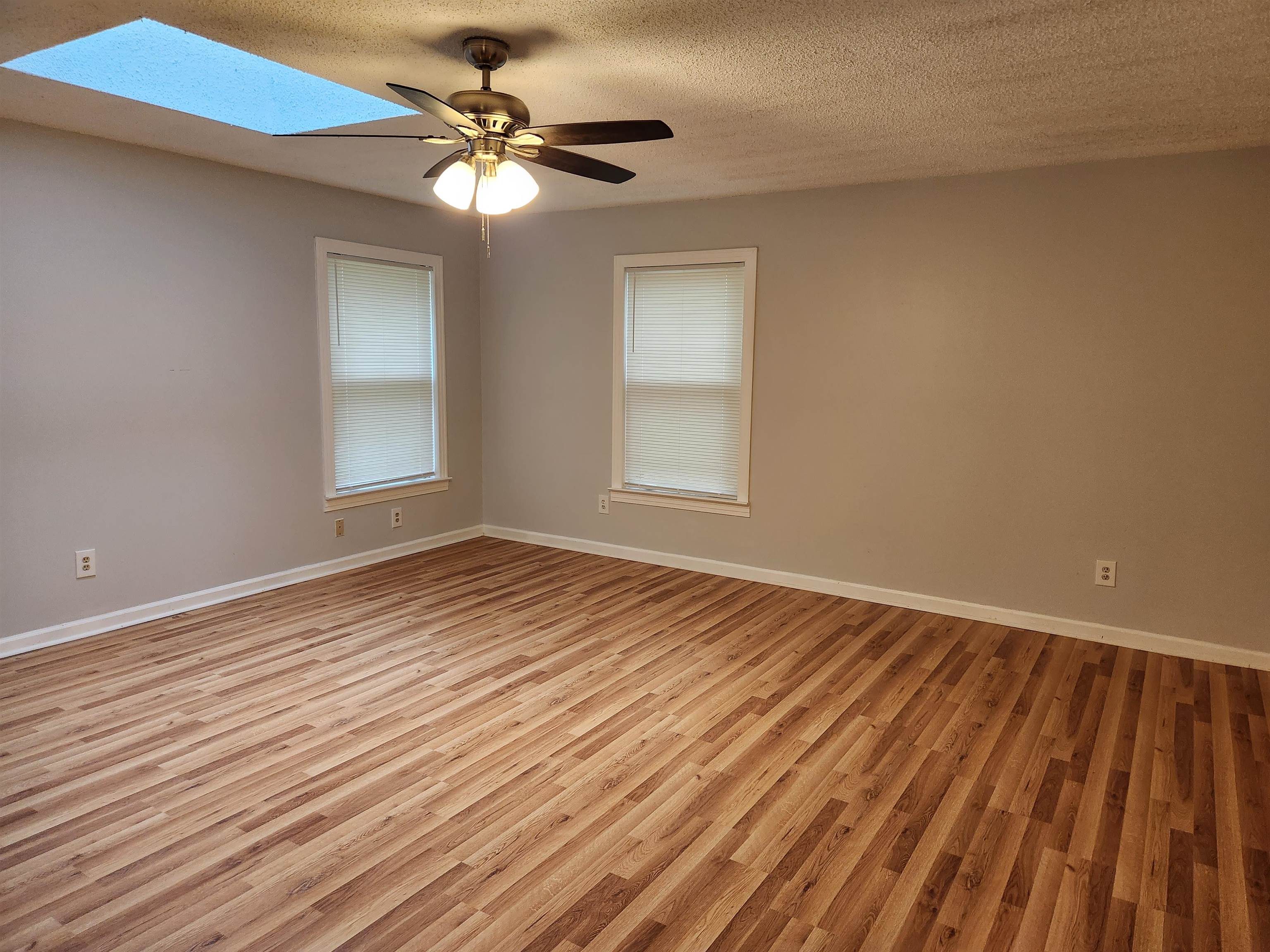 7188 Pleasant Ridge Road Arlington, TN 38002 - Photo 15 of 28 wooden floor in an empty room with a window